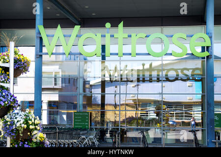 The front of a Waitrose store clearly showing he Waitrose company sign. The shop is located in Portishead, Bristol, UK