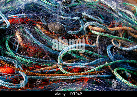 tangled up fishing nets in beautiful colors Stock Photo