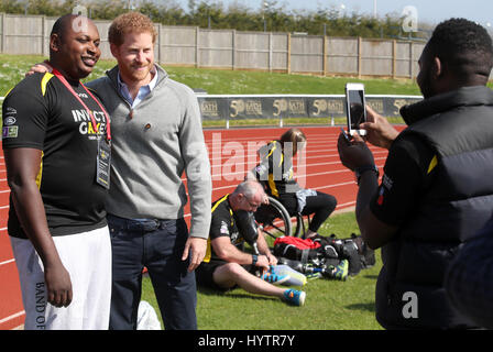 BATH, ENGLAND - APRIL 07: Prince Harry, Patron of the Invictus Games Foundation, poses with a competitor as he attends the UK team trials for the Invictus Games Toronto 2017 held at the University of Bath on April 7, 2017 in Bath, England. The Invictus Games is the only international sport event for wounded, injured and sick servicemen and women, both serving and veteran and was an idea developed by Prince Harry after he visited the Warrior Games in Colorado USA. (Photo by Chris Jackson - WPA Pool/Getty Images) Stock Photo