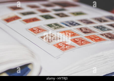 Album with Dutch vintage postage stamps Stock Photo