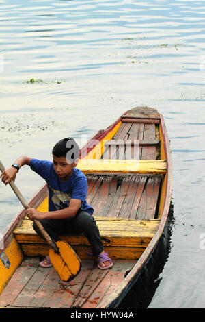 Dream a little dream on the Dal Lake, A Shikara Ride on the Dal Lake, a kashmiri boy, (Photo Copyright © by Saji Maramon) Stock Photo