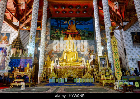 Main Buddha image and altar at Wat Phra That Cho Hae, a Buddhist temple in Phrae, Thailand. Stock Photo