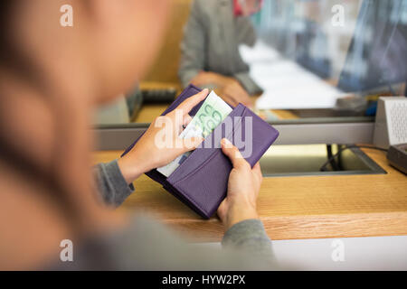 hands with money at bank or currency exchanger Stock Photo
