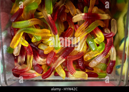 close up of gummy worms in box at candy shop Stock Photo