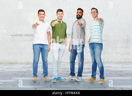 happy smiling men pointing finger to you Stock Photo