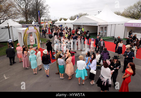 Racegoers queue for the Fabulous Friday stand on Ladies Day of the Randox Health Grand National Festival at Aintree Racecourse. Stock Photo