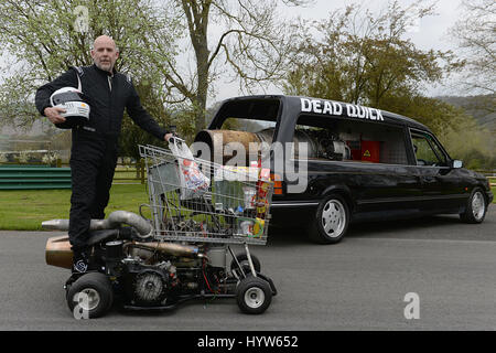 Matt McKeown on board the World's fastest shopping trolley as he unveils his converted 1992 Ford Cardinal hearse 'Dead Quick' at the Prescott Hill Climb in Gloucestershire. Stock Photo