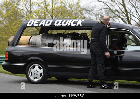 Matt McKeown with his converted 1992 Ford Cardinal hearse 'Dead Quick' at the Prescott Hill Climb in Gloucestershire. Stock Photo