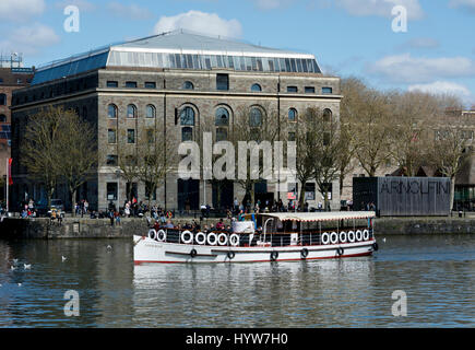 Tower Belle boat on the Floating Harbour passing the Arnolfini, Bristol, UK Stock Photo