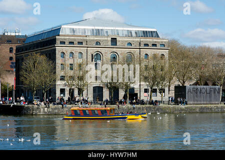 A ferry boat on the Floating Harbour passing the Arnolfini, Bristol, UK Stock Photo