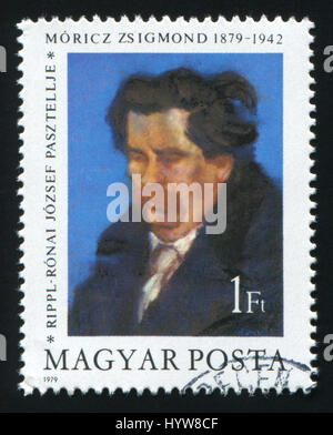 HUNGARY - CIRCA 1979: A post stamp printed in Hungary shows a painting of writer Zsigmond Moricz by Jozsef Ripple-Ronai, circa 1979 Stock Photo