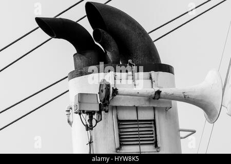 Low Angle View Of Ship Horn And Smoke Stack Against Stock Photo