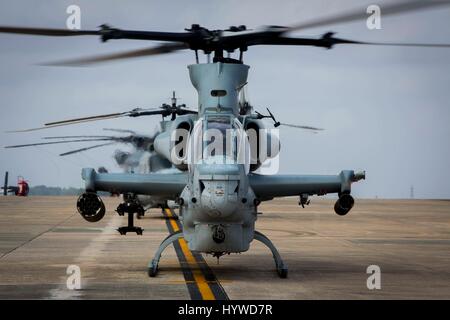 Owinawa, Japan. 26th Apr, 2017. A U.S. Marine Corps AH-1W Super Cobra attack helicopters begin pre-flight checks, prior to a Mission Rehearsal Exercise at Marine Corps Air Station Futenma April 26, 2017 in Okinawa, Japan. U.S. Forces across the Asian region have increased combat exercises as tensions continue to rise between the U.S. and North Korea. Credit: Planetpix/Alamy Live News Stock Photo