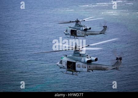 Owinawa, Japan. 26th Apr, 2017. Two U.S. Marine Corps UH-1Y Huey helicopters, with Marine Light Attack Helicopter Squadron- 267, fly in a formation during a Mission Rehearsal Exercise April 26, 2017 in Okinawa, Japan. U.S. Forces across the Asian region have increased combat exercises as tensions continue to rise between the U.S. and North Korea. Credit: Planetpix/Alamy Live News