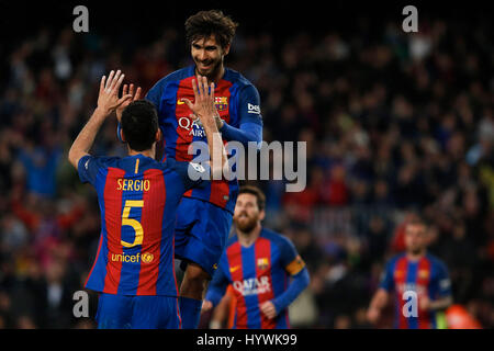 Barcelona, Spain. 26th Apr, 2017. Barcelona's Andre Gomes (Up) celebrates after scoring with teammate Sergio Busquets after scoring during the Spanish first division soccer match against CA Osasuna at the Camp Nou Stadium in Barcelona, Spain, April 26, 2017. Barcelona won 7-1. Credit: Pau Barrena/Xinhua/Alamy Live News Stock Photo