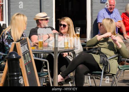 Weymouth Beach, Dorset, UK. 7th April 2017. Three women enjoying a drink on a warm sunny day  bringing people out to enjoy the seaside and beach along the Jurassic coastline. Credit: Dan Tucker/Alamy Live News Stock Photo