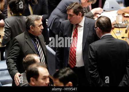 New York, New York, USA. 08th Apr, 2017.  Mounzer Mounzer (L), Syria's deputy ambassador to the United Nations, talks with Vladimir Safronkov (C), Russian deputy ambassador to the United Nations, prior to a Security Council emergency session on the situation in Syria at the UN headquarters in New York, on April 7, 2017. A divided UN Security Council met on Friday in emergency session to debate the U.S. Credit: Xinhua/Alamy Live News Stock Photo