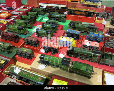A selection of rare and collectable tin-plate clockwork trains for sale at a Vintage Toy Fair at the Bath & West Showground, Somerset, England Stock Photo