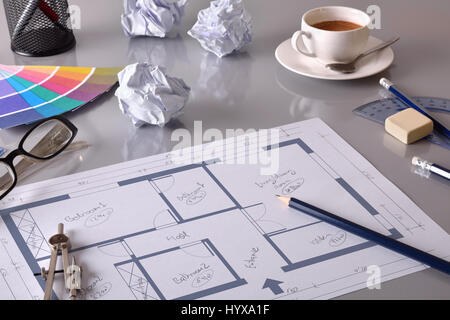 Drawing the interior of a house on the workbench of an engineer. With grey table and tools. Elevated view. Horizontal composition Stock Photo