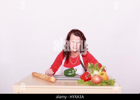 Cut angry Lady with the vegetables Stock Photo