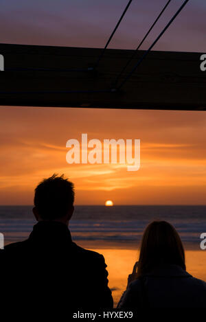 Sunset People Silhouette Couple Seaside Setting sun Coast Fistral Beach Evening End of the day Dusk Sea Ocean Leisure time Tourism Stock Photo