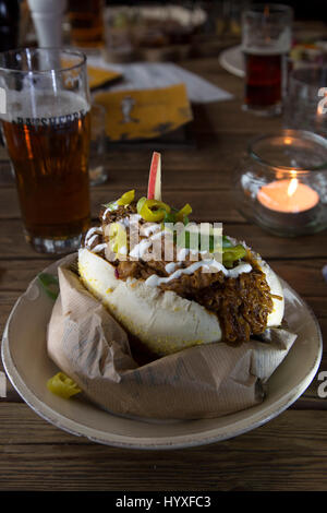 Pulled pork sandwich served on a plate. Stock Photo