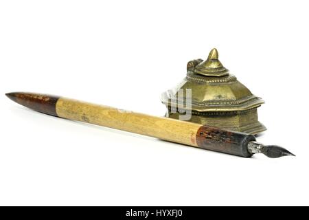 old dip pen and inkwell isolated on white background Stock Photo