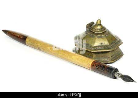 old dip pen and inkwell isolated on white background Stock Photo