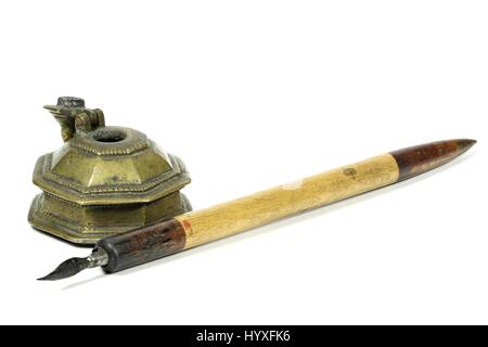 old dip pen and inkwell isolated on white background Stock Photo