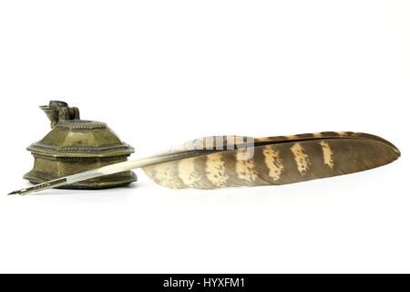 falcon quill pen and inkwell isolated on white background Stock Photo