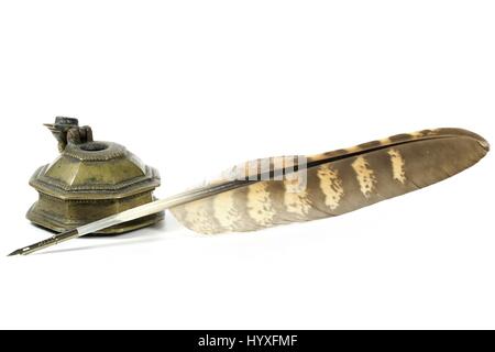 falcon quill pen and inkwell isolated on white background Stock Photo