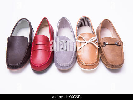 Different moccasins for a boy on a white isolated background Stock Photo