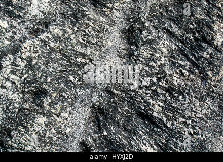 natural background with texture of the stone with different colored patches and cracks Stock Photo