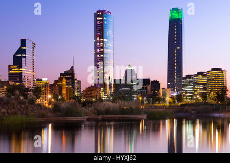 Pond at Bicentennial Park in the wealthy Vitacura district and skyline of buildings at financial district, Santiago de Chile Stock Photo