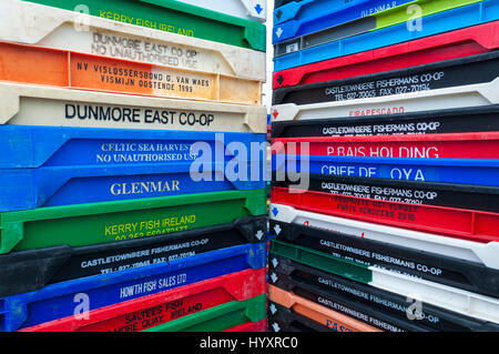 Colourful fish crates stacked up on quayside in Killybegs harbour, County Donegal, Ireland Stock Photo