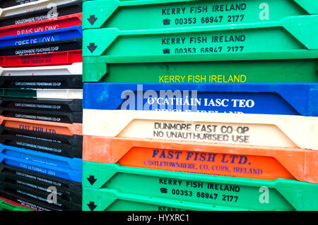 Colourful fish crates stacked up on quayside in Killybegs harbour, County Donegal, Ireland Stock Photo