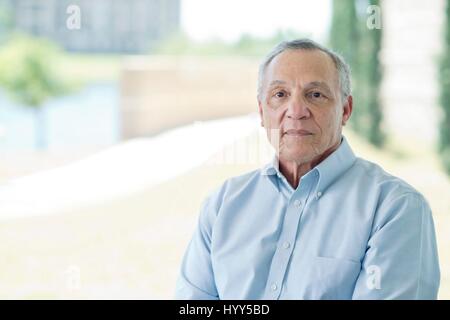 Senior man looking at camera. Stock Photo
