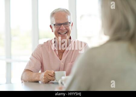 Senior man with cup of tea. Stock Photo