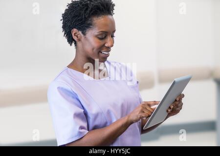 Female nurse using digital tablet. Stock Photo