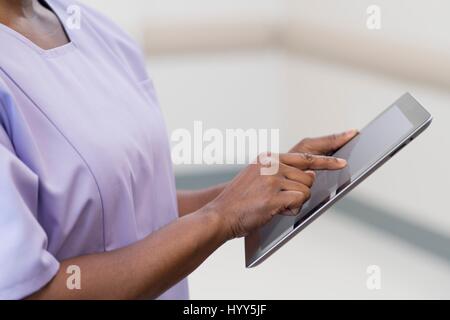 Female nurse using digital tablet. Stock Photo