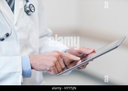 Male doctor using digital tablet. Stock Photo