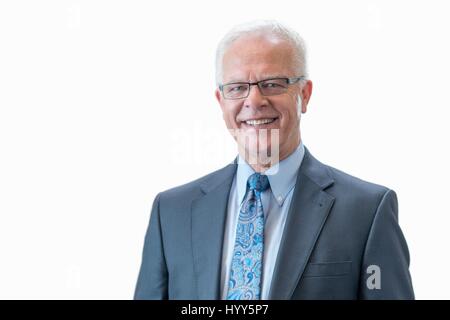 Senior man wearing suit jacket, studio shot. Stock Photo