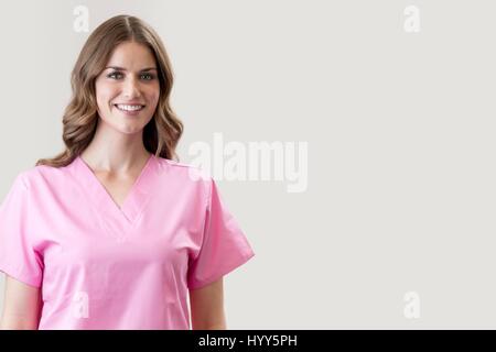 Female nurse smiling towards camera. Stock Photo