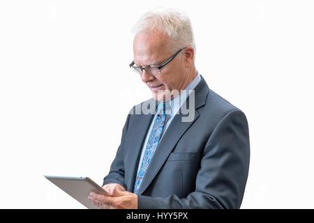 Senior man using digital tablet. Stock Photo