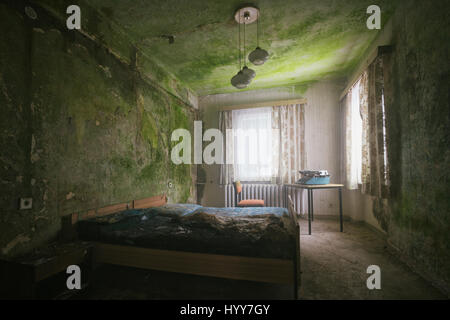 UNNERVING images show how a green carpet of mould is taking over the walls and ceilings of what was once a grand hotel.Other disturbing  and rarely seen pictures show the gruesome state of the hotel building, with most of its walls and ceilings entirely covered in the green mould, rubble scattered on every floor and an empty indoor swimming pool vandalised with graffiti. Captured in Germany by urban explorer Katuszynski Alexandre (46), on a reflex Canon with a basic tripod, these spine-chilling photographs present a once lively hotel that has moulded and died with age. Katuszynski Alexandre /  Stock Photo