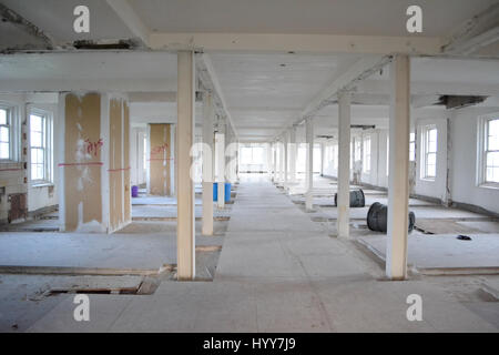 NEW JERSEY, USA: EERIE images and video have revealed the crumbling remains of an abandoned isolation hospital where children were allegedly abused and was the set for the hit Russel Crow movie A Beautiful Mind. The spooky pictures and footage show the contrasting conditions in the left wing and right wing of the old hospital building. The left wing, abandoned since the 1970s, is a flaking, dilapidated mess while the right wing, abandoned in more recent years, looks like it could still be active. Other haunting shots show the rusty padlocked doors, biohazard bags left behind and medical equipm Stock Photo