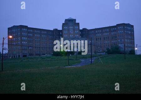 NEW JERSEY, USA: EERIE images and video have revealed the crumbling remains of an abandoned isolation hospital where children were allegedly abused and was the set for the hit Russel Crow movie A Beautiful Mind. The spooky pictures and footage show the contrasting conditions in the left wing and right wing of the old hospital building. The left wing, abandoned since the 1970s, is a flaking, dilapidated mess while the right wing, abandoned in more recent years, looks like it could still be active. Other haunting shots show the rusty padlocked doors, biohazard bags left behind and medical equipm Stock Photo