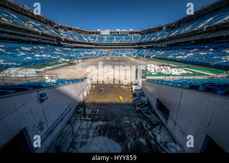 PONTIAC, USA: HAUNTING pictures have revealed the crumbling remains of an 82,000 seat American football stadium that saw its last touchdown long ago. The eerie images show the rows of thousands of blue plastic seats which now lie empty in view of the scorched square of earth where the lush green pitch once was. Other shots of the former Detroit Lions stadium show rubble-strewn remnants of the VIP boxes and forgotten beer bottles and condiments left sitting on a table. The creepy snaps were taken at the Pontiac Silverdome in Pontiac, Michigan by American photographer Jeff Hagerman (36) from Atl Stock Photo