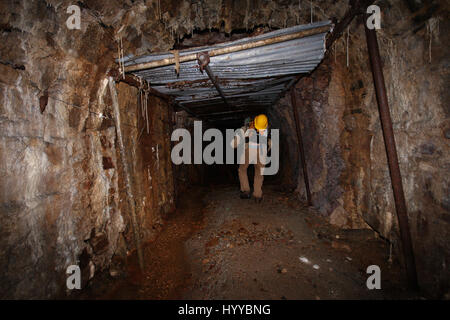 CALLINGTON, CORNWALL, UK: EERIE images reveal the Cornish mining tunnel that was once used to test explosives and research the potential impact of nuclear tests during the Cold War under the code name Operation Orpheus. The haunting pictures show inside the 2,180-foot tunnel where rusting sleepers and collapsing structures remain. Other shots, look down into an adit (entrance) and show the unsuspecting exterior of the mine where a metal gate has been closed across. The spectacular images were taken at the Excelsior Tunnel, Kit Hill, Callington, Cornwall by editor, Nat W (46) from London. To ta Stock Photo