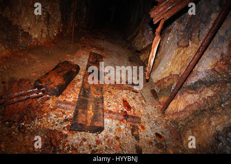 CALLINGTON, CORNWALL, UK: EERIE images reveal the Cornish mining tunnel that was once used to test explosives and research the potential impact of nuclear tests during the Cold War under the code name Operation Orpheus. The haunting pictures show inside the 2,180-foot tunnel where rusting sleepers and collapsing structures remain. Other shots, look down into an adit (entrance) and show the unsuspecting exterior of the mine where a metal gate has been closed across. The spectacular images were taken at the Excelsior Tunnel, Kit Hill, Callington, Cornwall by editor, Nat W (46) from London. To ta Stock Photo